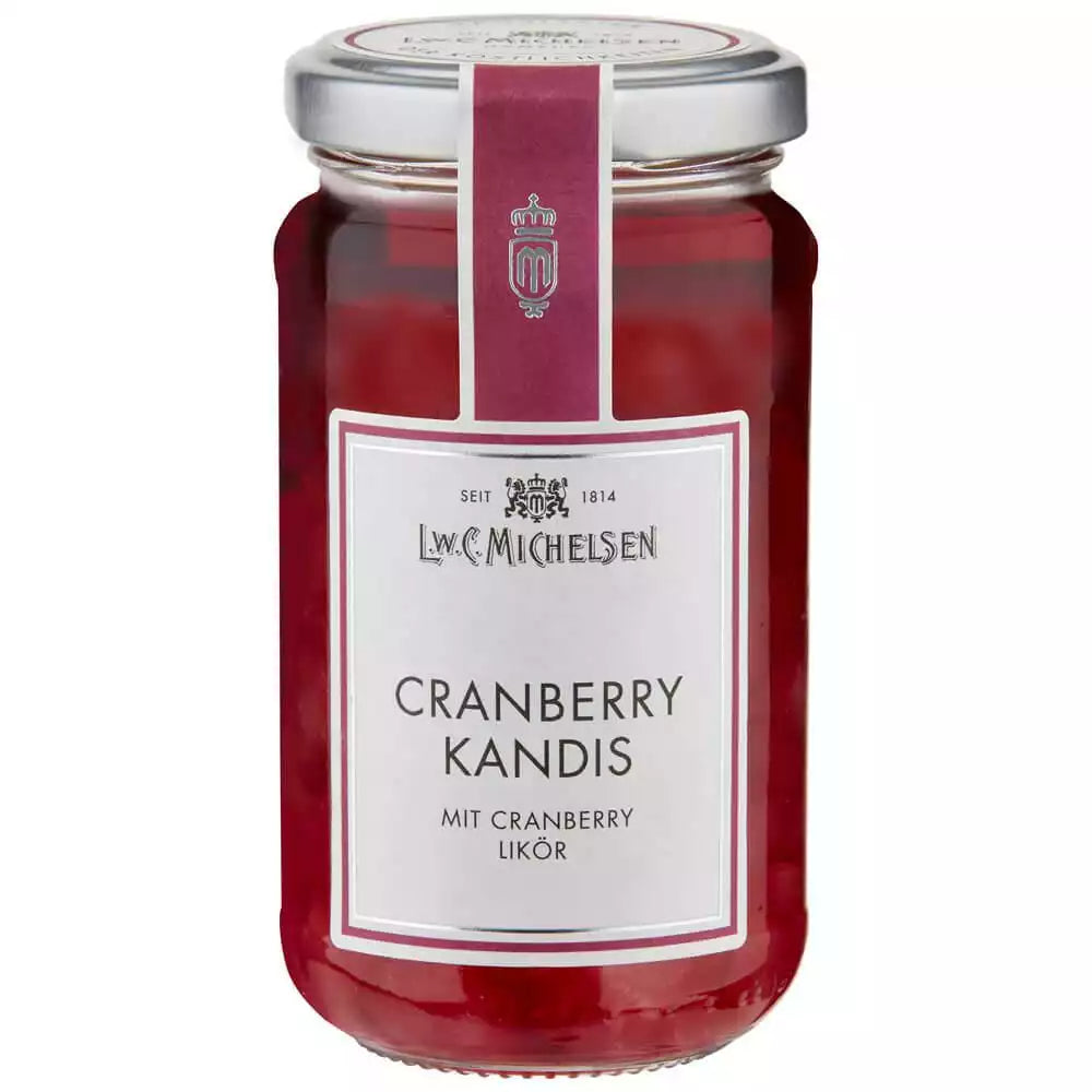 Cranberry Kandis im Glas von L.W.C. Michelsen. Süßer Kandiszucker mit Cranberry Likör, ideal zum Süßen von Tee im Teegeschäft Teepunkt.